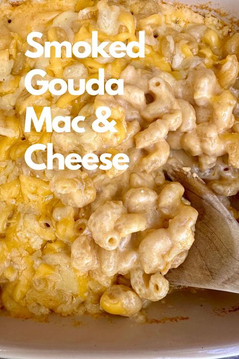 A dish of mac and cheese with s spoon. Giada Mac And Cheese, Flemings Mac And Cheese, Mac And Cheese With Smoked Gouda, Smoked Gouda Mac And Cheese Baked, Crockpot Gouda Mac And Cheese, Muellers Mac And Cheese Recipe, Heavy Cream Mac And Cheese, Mac And Cheese Recipe Gouda, Thanksgiving Mac And Cheese Recipe