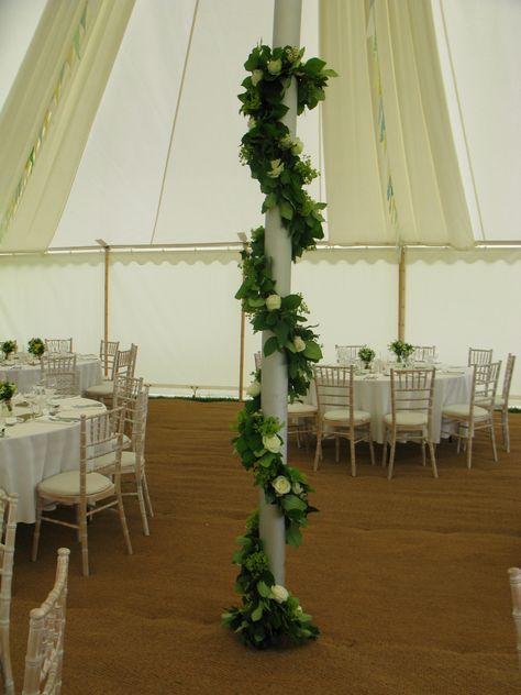 The poles in this traditional marquee were decorated with garlands of foliage, roses and daisies. Traditional Marquee, Pillar Decorations, Roses And Daisies, Flowers Decoration, Metal Pole, Diy Roses, Marquee Wedding, Floral Ideas, Tent Wedding