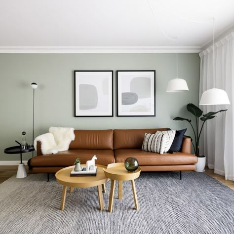 20 Chic Scandinavian Living Room Ideas With Nordic Inspiration | Displate Blog Green Wall Brown Couch, Green Walls Living Room, Brown Sofa Living Room, Room Scandinavian, Living Room Wall Color, Room Wall Colors, Dark Living Rooms, Scandinavian Living Room, Nordic Living Room