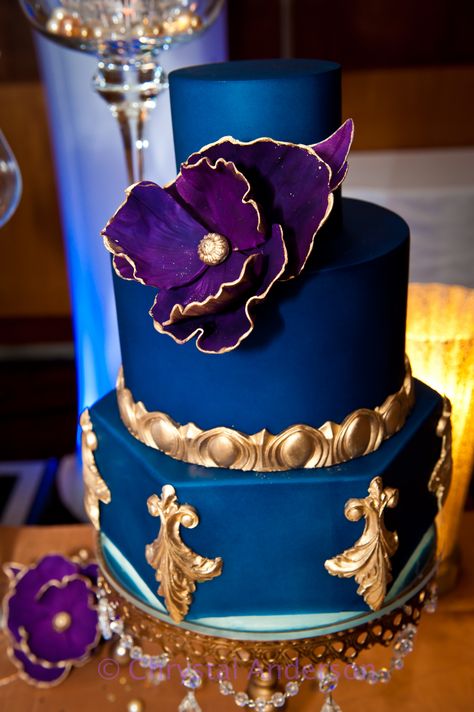 Royal blue, gold, purple cake Purple Blue Gold Party Decorations, Blue Gold And Purple Wedding, Purple Blue Gold Birthday Party, Royal Blue Purple And Gold Wedding, Royal Blue And Purple Wedding Cake, Purple Blue Gold Wedding, Purple And Blue Quinceanera Ideas, Royal Blue And Purple Wedding Theme, Blue And Purple Wedding Cake