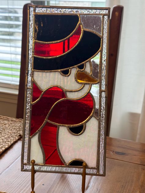 This Snowman panel will make a great gift for your family and friends and it will add a little holiday cheer to any room. This panel is 12" tall by 6" wide and it includes the stand and is available in the three colors shown in the pictures. Don't hesitate or this great item will be in someone else's home for the holidays.  Please share this listing with everyone and message me with any questions or for special order requests. Stained Glass Christmas Patterns Free Printable Easy, Stained Glass Snowman Pattern, Snowman Stained Glass Patterns, Christmas Stained Glass Ideas, Stained Glass Christmas Patterns, Christmas Stained Glass Patterns, Stain Glass Christmas, Contemporary Stained Glass Panels, Stained Glass Christmas Ornaments