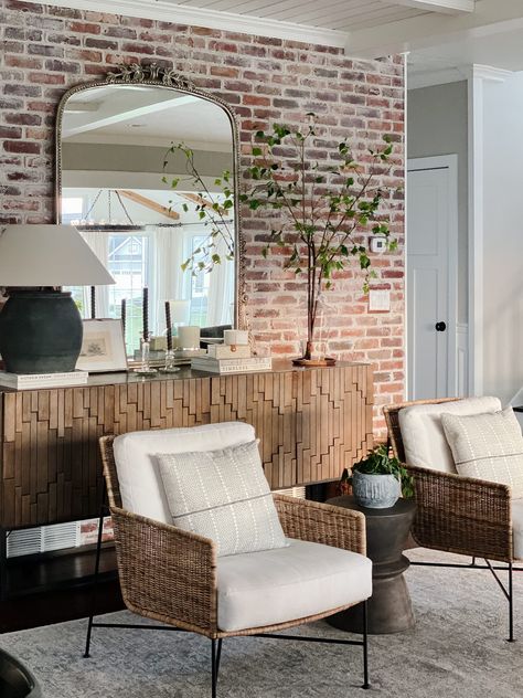 Brick Wall Sofa, Decorating Brick Wall Living Room, Shelves Brick Wall, Natural Brick Wall Interior, Light Brick Interior Wall, Photos On Brick Wall, Brick Wall Fireplace Decor, Brick Wall Spa Room, Japandi Brick Wall