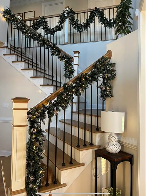 Christmas decor, christmas garland, aesthetic christmas, winter decor Christmas Garland On Railing, Christmas Decor Ideas Stair Railing, Garland Railing Christmas, Stairs Christmas Garland, Christmas Decor Ideas For Stair Railings, Christmas Deck Railing Decorating Ideas, Stair Rail Christmas Decor, Garland On Stair Railing, Banister Christmas Decor Railings