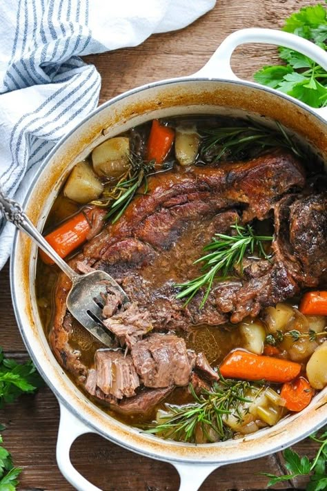 Tender and juicy, this Dutch Oven Pot Roast transforms an affordable cut of meat into a delicious comfort food dinner. The beef slowly bakes with potatoes and carrots for an easy one pot meal. Your whole family will love this classic Sunday pot roast recipe! Chuck Roast Recipe Pot Roast In Dutch Oven Easy, Best Dutch Oven Pot Roast Recipes, Amazing Pot Roast, Dutch Oven Pot Roast Recipes Without Wine, Durch Oven Pot Roast, Beef Roast Recipes, Roast In Dutch Oven, Sunday Soup, Recipes Hamburger