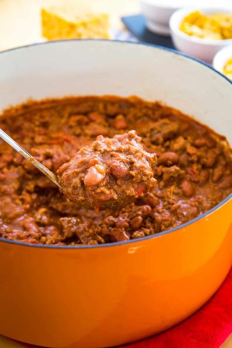 With ground beef, stew meat, bacon, and beans, this Beef Chili may just be the world's best chili recipe! Let it simmer on the stovetop, then get ready to enjoy a bowl with all of your favorite toppings and fixings. Recipe With Stew Meat, Ground Beef Stew, Bacon Beans, Stovetop Chili, Steak Chili, Homemade Chili Recipe, Ground Beef Chili, Meat Chili, Beef Chili Recipe