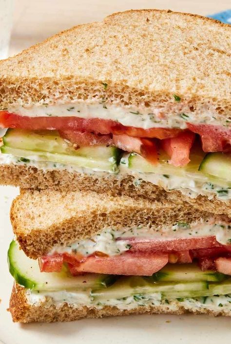 This herby cucumber and tomato sandwich is crisp and refreshing, making the most out of summer's bounty. Pack this easy, quick sandwich for a cold lunch for work Cold Vegetarian Sandwich, Cucumber Tomato Sandwiches, Cucumber And Tomato Sandwich, Tomato Sandwich Ideas, Cold Vegetarian Sandwich Ideas, Easy Vacation Lunch Ideas, Roadtrip Sandwich Ideas, Summer Lunches For Work, Cold Lunch Ideas Healthy