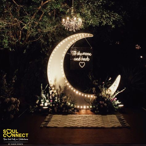 This moon backdrop idea is perfect for sagan and engagement functions. Telling story with elements is the goal. Celestial Wedding Ceremony Backdrop, Moon Engagement Party, Space Themed Wedding Reception, Moon Decor Wedding, Rustic Starry Night Wedding, Photobooth Space Theme, Moon Stars Wedding Theme, Moon Wedding Decorations, Moon Wedding Backdrop