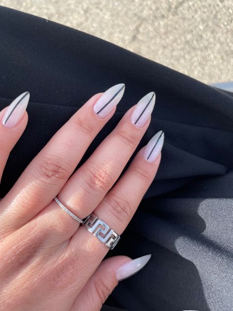 minimalistic long nails inspo with white base and black line #minimalist #nailsart #nailsoftheday #nailstagram Line Down The Middle Nails, Straight Line Nail Art, Linework Nails, Minimalistic Nails, White Almond Nails, Black Almond Nails, Long Almond Nails, Black White Nails, Line Nail Art