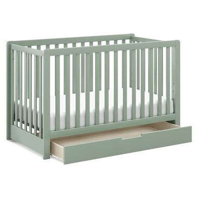 The Carter’s Colby crib with a spacious trundle drawer features clean lines and a spacious, built-in trundle for a beautiful and practical nursery. Converts to a toddler bed, day bed, and full-size bed for use long past the nursery years. Color: Light Sage Carter's by DaVinci Colby 4-in-1 Convertible Crib with Storage - Cribs in Green | Perigold Sage Green And Pink Nursery, Aspen Bedroom, Crib With Storage, Practical Nursery, Bed Day, Shortcake Cake, Room Girl, Baby Playroom, Baby Storage