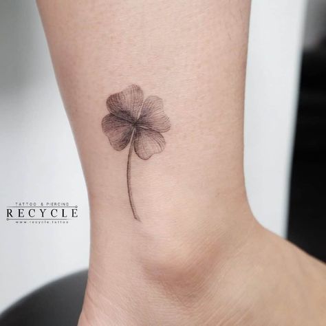 Small Black Flower Ankle Tattoo Minimalist 4 Leaf Clover Tattoo, Lightning Flower Tattoo, Four Leaf Clover Tattoo Black And White, Clover Ankle Tattoo, Purple Clover Tattoo, Small Black Tattoo For Women, Small Celtic Tattoos For Women, Behind Ankle Tattoo, 5 Leaf Clover Tattoo