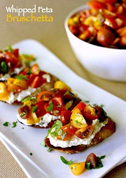 This week is going to be all about east summer appetizers. Bruschetta appetizers to be exact! All types of bruschetta like this Whipped Feta Bruschetta for serving at parties!   What is the perfect summer appetizer? Anything that fresh and in season, tossed with the perfect ingredients and served on a tasted baguette...like this Whipped Feta Bruschetta. See, people who know me think I don't like vegetables. I do, I like lots of vegetables, they just have to be done the right way. A big bunch ... Pickle Rolls, Feta Bruschetta Recipe, Feta Bruschetta, Bruschetta Appetizer, Easy To Make Appetizers, Bruschetta Recipe, Whipped Feta, Italian Appetizers, Summer Appetizer