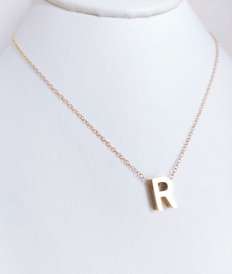 R gold stainless necklace great to wear it as stylish base neck choker with a shiny stainless capital letter dangling from a high quality gold filled chain which is adjustable with an extension chain. The R initial gold or silver stainless charm is 1/2" R Necklace Letter, Valentine's Day Gold Plated Initial Pendant Jewelry, R Initial Necklace, Valentine's Day Gift: Initial Necklace With Name, Valentine’s Day Initials Pendant Necklace, Stainless Necklace, R Initial, Necklaces Gift, Teen Friends