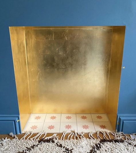 Gold leaf fireplace with starburst tiles and no surround Gold Tiles Fireplace, Gold Leaf Fireplace Surround, Fire Surround Tiles, Gold Fireplace Mantle, Gold Painted Fireplace, Gold Leaf Fireplace, Fireplace No Surround, Gold Fireplace Makeover, Wallpapered Fireplace