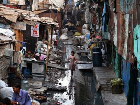 Dharavi Slum, Mumbai. Photograph by Jonas Bendiksen/National Geographic Stock. A young girl walks through Mumbai's Dharavi slum, home to about a million people. Many Indians live in modern suburbs and work in gleaming skyscrapers, but many more—a large majority—remain impoverished and trapped by tradition. Poverty In India, Urban Poverty, Shanty Town, National Geographic Magazine, Photographer Portfolio, We Are The World, Magnum Photos, People Of The World, Urban Area