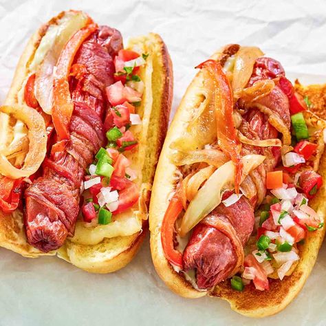 Mexican Hot Dogs are bacon wrapped hot dogs topped with Pico de Gallo, sautéed peppers and onions, and queso fresco. Get the easy recipe. Hotdogs Mexicanos, Mexican Hot Dogs Recipes, Mexican Hot Dogs, Bacon Wrapped Recipes, Sautéed Peppers, Crockpot Chicken Spaghetti, Bacon Wrapped Hotdogs, Wrapped Hot Dogs, Sauteed Peppers And Onions