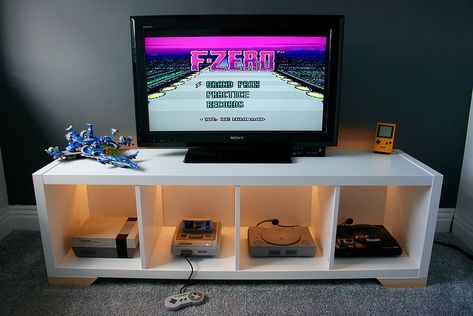 So, I wanted to convert my 1 x 4 KALLAX into a retro games console unit. I wanted to make it look like a media unit though, not just a KALLAX lying down! Console Display, Kallax Shelf Unit, Kallax Shelving Unit, Retro Games Room, Retro Console, Retro Games Console, Video Game Rooms, Ikea Hackers, Console Storage