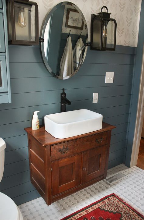 White Buffalo Styling Co. | FRESH COUNTRY BATH BEFORE & AFTER | After a long bathroom renovation in partnership with Lowe's Home Improvement stores, Lindsay from White Buffalo Styling Co. updated her bathroom to add style, personality, and function. She installed Pfister’s Ashfield vessel faucet with a white porcelain sink. The Tuscan Bronze finish really stands out against the slate blue paint. Country Blue Bathroom Ideas, Blue Painted Shiplap Bathroom, Adirondack Blue Bathroom, Rustic Lake House Bathroom, Slate Blue Bathroom Ideas, Country Bathroom Colors, Blue Bathroom Ideas Paint, Country Blue Bathroom, Blue Shiplap Bathroom