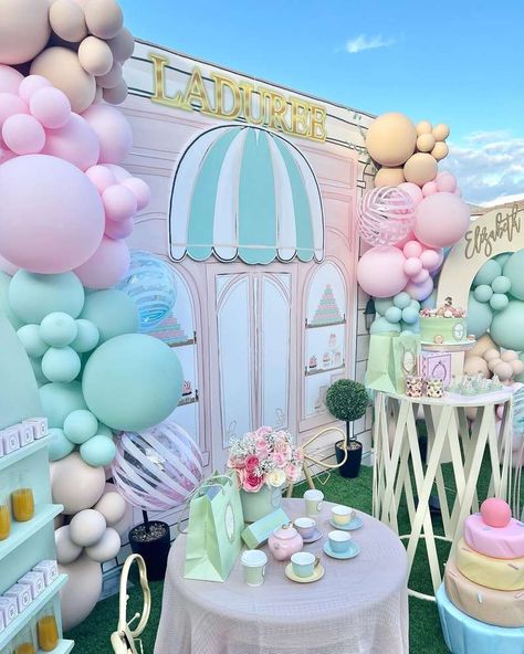 Elizabeth’s 3rd birthday | CatchMyParty.com Macaroon Birthday Party Theme, Pastel Tea Party Decorations, Macaron Themed Birthday Party, Eloise Birthday Party, Bakery Birthday Party, Bakery Birthday Party Ideas, French Bakery Birthday Party, Laduree Party Theme Birthday, Laduree Birthday Cake