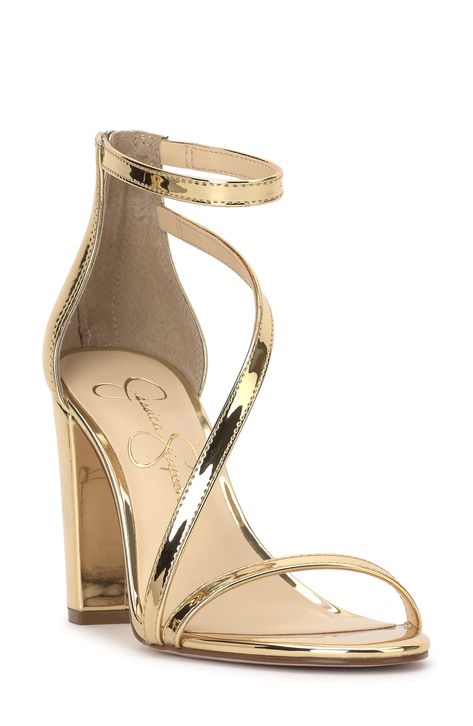 An asymmetric vamp strap creates modern dimension on a trend-savvy sandal lofted by a wrapped block heel. 3 1/2" heel Textile upper/synthetic lining/rubber sole Imported Gold Metallic Shoes, Heels For Gold Dress, Elegant Gold Heels, Gold Hoco Shoes, White Gold Heels, Light Gold Heels, Prom Shoes Ideas, Heels For Homecoming, School Dance Shoes