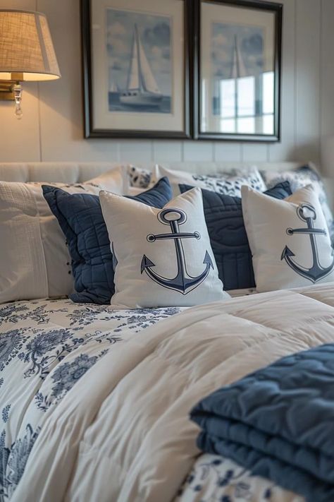 15 Aesthetic Coastal Bedroom Ideas for a Dreamy Retreat 5 Beach Themed Master Suite, Nautical Bedroom Master Decorating Ideas Navy Blue, Navy And White Coastal Bedroom, Nautical Master Bed, Nautical Bedroom Master, Seaside Bedroom Ideas, Nautical Bed, Bedroom Beach Decor, Nautical Bedroom Ideas