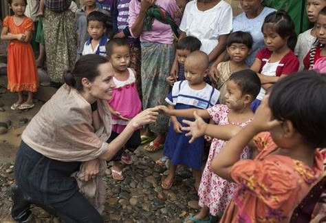 Brad Pitt and Angelina Jolie are adopting another child, a Syrian refugee, according to a recent report. The couple are adding to their already massive family Angelina Jolie Charity Work, Angelina Jolie Helping People, Angelina Jolie Refugees, Angelina Jolie Volunteer, Angelina Jolie Philanthropy, Angelina Jolie Humanitarian Work, Angelina Jolie Unicef, Angelina Jolie Humanitarian, Angelina Jolie Charity