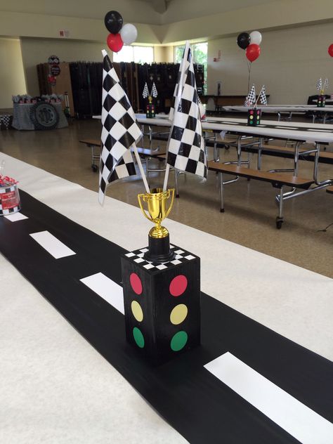 Race car - stop light center piece Made out of wood Stop Light Centerpiece, Hot Wheels Main Table, Racecar Party Centerpieces, Race Car Birthday Table Decor, Trunk Or Treat Race Car Theme, Race Car Birthday Party Ideas Food Checkered Flag, Race Car Themed Centerpieces, Cars Themed Centerpieces, 2 Fast Birthday Party Centerpieces