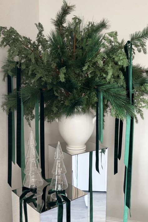 How to Create a Modern Christmas Floral Arrangement with Velvet Ribbon and Mirrored Pedestals | The Savvy Heart | Interior Design, Décor, and DIY Mirrored Pedestals, Modern Round Dining Room, Holiday Floral Arrangements, White Urn, Holiday Arrangement, Candle Wrap, Christmas Floral Arrangements, Faux Greenery, Green Theme