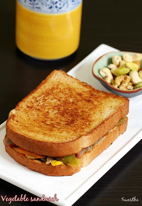 Veg sandwich recipe – A simple mixed vegetable sandwich for breakfast or evening snack. I have made this sandwich without a grill, toaster or oven, just made it on a pan in the simplest way. I have not used any sauce or green chutney for this so it is good even to make on a … Vegetable Sandwich Recipes, Sandwich Recipes Indian, Vegetable Sandwich, Veg Sandwich, Veg Snacks, Easy Sandwich Recipes, Easy Vegetable, Vegetarian Sandwich, Bread Snacks