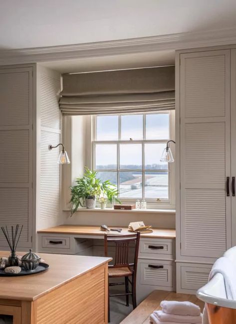 A dressing table underneath a window with field beyond Closets Flanking Window, Closet Around Window With Desk, Table Under Window Bedroom, Dressing Table In Window, Dressing Room With Desk, Closet Sitting Room, Dressing Table Window, Sash Window Dressing, Dressing Table Under Window