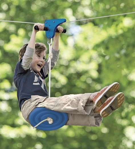 8 Outrageously Cool Swings & Hide-Outs That Will Keep Your Kids Outside. All. Summer. Long. - what moms love Diy Zipline, Kids Zipline, Zip Line Backyard, Cool Swings, Taman Air, Tree House Diy, Build A Playhouse, Tree House Kids, Diy Playground