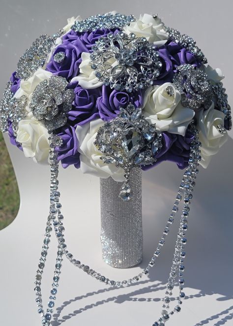 Foam Roses Brooch Bouquet is made up with ivory, purple roses, which will last long and will never fade. Its even more stunning and beautiful in person. This Luxury Brooch  Bouquet is approx 8 inches wide, brooches in multi sizes.  Handle wrapped in silver rhinestones. Royal Purple And White Wedding, Purple Flower Bouquet Wedding, Purple White Silver Wedding, Quince Bouquet Purple, Wedding Bouquets Purple, White Silver Wedding, Roses Bouquet Gift, Enchanted Forest Birthday, Purple And Silver Wedding