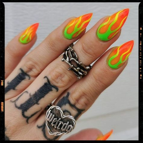 Acrylic Nails Green Flame Nail Art, Neon Flames Nails, Neon Orange And Green Nails, Neon Flame Nail Art, Orange And Green Halloween Nails, Download Festival Nails, Neon Festival Nails, Orange Nails Summer Neon, Rock Festival Nails