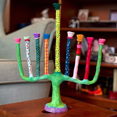 Lulu Krause on Instagram: "Hand-sculpted menorah, made of wire, a RAO’s tomato sauce lid, and polymer clay. I started making this after seeing Labyrinth for the first time, and wanted to create a menorah for the Goblin King himself! I’m excited to use this this coming Thursday, and for many Hanukkahs to come. Swipe for process pics (that include two glimpses of the shows I watched while working on this for the past seven days)." Animation Painting, The Goblin King, Diy Pottery Painting, The Goblin, Goblin King, Diy Pottery, Ceramics Pottery Art, Jewish Art, Pottery Designs