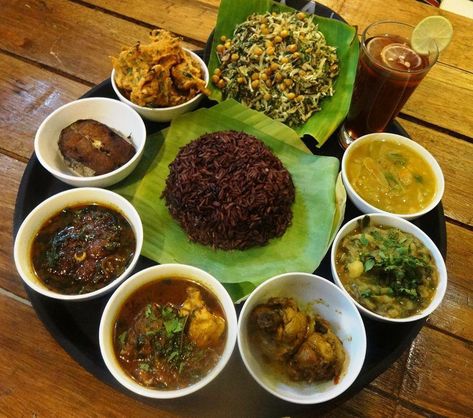 The Manipuri thali (Meitei) is simple, tasty and centered around fish, seasonal vegetables, and sticky rice. Manipuri thali includes eromba (fermented hidol fish and vegetables), sinju (cabbage and local greens salad), thanbou (lotus stems), ooti (peas curry), chareng (a fish curry), pakora thongba (gram flour curry), manikha (a mix of brinjal and fish oil), kangsoi (veg stew), chambut (boiled papaya), kangsoi (boiled dry fish) and, of course, a mustard chutney. The perfect end to the meal is pr Curry Pakora, Bitter Gourd Fry, Veg Stew, Cluster Bean, Greens Salad, Rice Desserts, Seasonal Vegetables, Tomato Chutney, States Of India