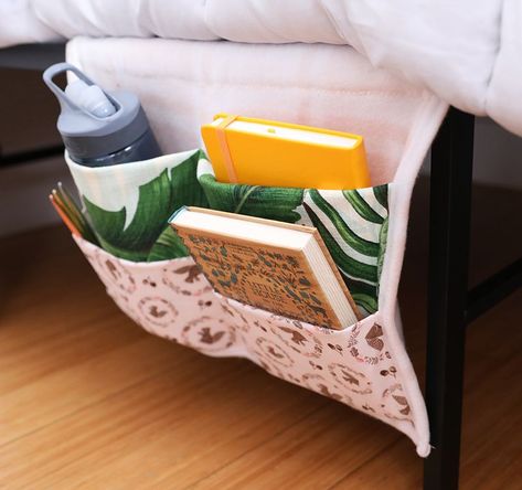 Get lounge-ready by crafting this ingenious bedside organizer from fabric scraps Bedside Caddy Diy Pattern, Bedside Book Holder, Bedside Pocket Organizer Diy, Armchair Organizer Pattern, Bed Organizer Bedside Caddy, Bedside Pocket Organizer, Bed Pockets Pattern Bedside Caddy, Bedside Pocket, Caddy Diy