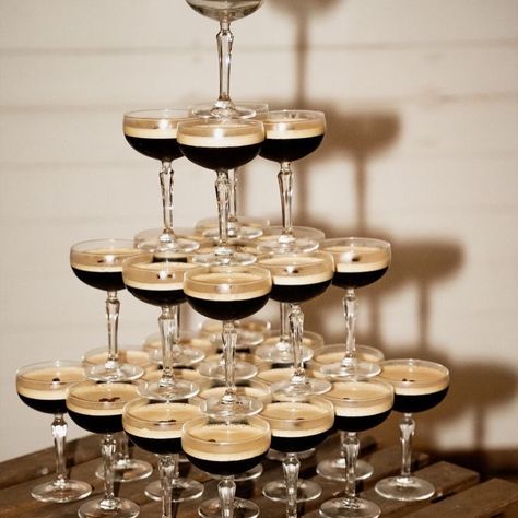 A more caffeinated version of your classic champagne tower, OH we love it!! Photography @lea.and.lensphotography Espresso Martini Wedding Drink, Standing Reception Wedding, Espresso Martini Fountain, Espresso Martini At Wedding, Espresso Bar At Wedding, Espresso Martini Bachelorette Party, Wedding Espresso Bar, Wedding Espresso Martini, Espresso Martini Tower Wedding