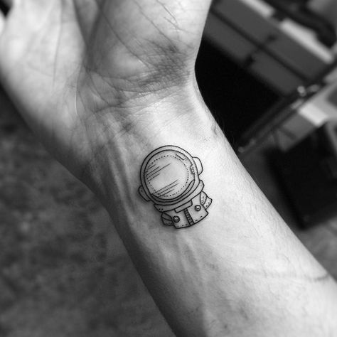 Explore the universe on your wrist! This astronaut helmet tattoo symbolizes the vast, unknown depths of space and our endless curiosity. Save this for future ink inspiration & follow for more cosmic designs. Rendered in stark black, the intricate shading and reflections bring this petite piece of the cosmos to life. #SpaceTattoo #AstronautInk #BlackInkArt #TinyTattooIdeas #CosmicDesign #AiImage Astronaut Helmet Tattoo, Helmet Tattoo, Black Ink Art, Astronaut Helmet, Ink Inspiration, Space Tattoo, The Cosmos, Minimal Tattoo, Arm Tattoo