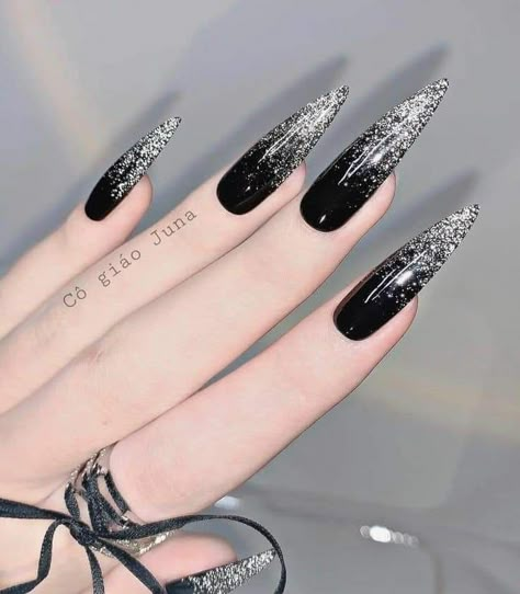 Long Black Stilleto Nails Design, Black And Silver Goth Nails, Goth Stilleto Nails Designs, New Year Nails Design 2024 Black, Nail Designs Long Black, Pointed Acrylic Nail Designs, Goth New Years Nails, Black Nails Acrylic Stilettos, Black And Silver Nails Acrylic