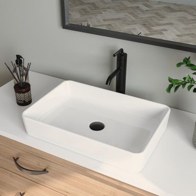 Being made from high-quality ceramic with a seamless and sleek design makes the modern white countertop ceramic rectangular bathroom vessel sink extremely durable. Its surface is scratch and stain-resistant and is easy to maintain with regular cleaning. With a rectangular design and glossy surface, this vessel sinks easily and updates any traditional, transitional, or contemporary bathroom. Sink Finish: White | DeerValley Ally 20" Ceramic Rectangular Vessel Bathroom Sink in White, Size 4.37 H x Over The Counter Sink Bathroom, Rectangle Vessel Sink Bathroom, Square Vessel Sink Bathroom, Counter Sink Bathroom, Glass Vessel Sink Bathroom, Bathroom Favorites, Nola House, Bathroom Sink Countertop, Above Counter Bathroom Sink