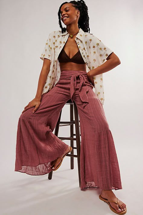 Forever flattering with that only-at-FP touch, these sweet pants from our FP One collection will turn heads with every wear. **Fit:** High-rise, exaggerated wide flare silhouette **Features:** Textured woven fabrication, tie detail at the waist, tiered seaming, partially lined **Why We ❤ It:** Elevated with sleek platforms or off-duty with sporty sneakers, this pair has endless ways to wear. | FP One Good Day Wide-Leg Trousers at Free People in Wine, Size: Large Wide Leg Jeans Photoshoot, Barcelona Clothing Style, Double Gauze Pants, Free People Outfit Inspiration, Free People Outfits Bohemian, Womens Pants Outfits, College Pants, Senior Pics Outfits, Free People Outfits