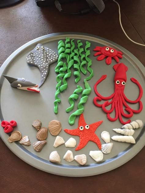 Handmade fondant sea creatures for an ocean theme cake. Diy Ocean Cake, Ocean Clay Ideas, Sea Creatures Cake Ideas, Sea Creature Cake, Clay Sea Creatures, Fondant Sea Creatures, How To Make Fondant Sea Creatures, Under The Sea Fondant Decorations, Ocean Theme Cake