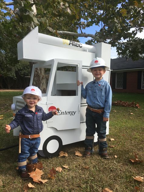 Lineman Costume and Bucket Truck. I made the bucket truck on top of a wagon. I ordered the hard hat on the left from amazon as well as their tool belts. The hooks for their feet are made out of belts, command hooks (spray painted), and metal bonding plates from lowes. Bucket Truck Lineman, Truck Canopy, Lineman Wife, Bucket Truck, Light Em Up, Tool Belts, Kids Belt, Command Hooks, Kid Hacks