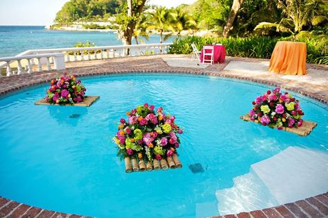 like the idea of floating candles and/or flowers in the pool during the reception.  Not a fan of this particular configuration however (colors). Floating Arrangements, Poolside Wedding Ceremony, Long Wedding Table Decorations, Pool Decorating Ideas, Wedding Pool Party Decorations, Floating Pool Decorations, Pool Wedding Decorations, Pool Decorations, Pool Events