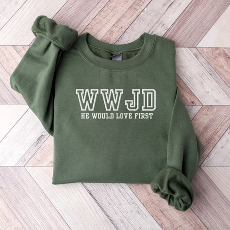 Get ready to fall in LOVE with your new embroidered WWJD sweatshirt. It's the cutest and most comfortable way to wear the latest styles, and also makes a great gift! * PRODUCT DETAILS * ✺ Soft preshrunk 50% cotton, 50% polyester blend ✺ Medium weight fabric (super soft feel) ✺ Wash and dry normally (on cool for best results) ✺ Designed and printed in the USA ✺ Due to different monitor screens, colors may vary ✺ * SIZING * ✺ FOR AN OVERSIZED FIT, SELECT TWO OR THREE SIZES UP FROM YOUR NORMAL SIZE Festival Shirts, Merry Christmas Shirts, Social Worker, Limassol, Look Plus, Christmas Sweatshirts, Kid Names, 50 50, Family Christmas