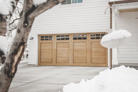 Light Brown Garage Door, White House With Wood Garage Doors, Oak Garage Doors, Brown Garage Door, Exterior Garage Door, Faux Wood Garage Door, Double Garage Door, Wood Garage Doors, Garage Door