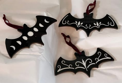 Acrylic bat ornaments with acrylic inlay and wooden backer! These little bats are stunning in person! Would make a great gift!  These ornaments will for sure be a conversation piece in your house! Not only can you use them on the tree but they would be cute just about anywhere!  These measure  7.9 inches wide  3.9 inches tall  There is three options to choose from for style but you can also choose from white bats with black inlays or black bats with white inlays!  Thank you so much for taking a look at my listing you made my entire day! Diy Gothic Christmas Ornaments, Gothic Christmas Decorations, Goth Christmas Ornaments, Bat Ornaments, Spooky Christmas Ornaments, White Bats, Creepmas Ornaments, Goth Crafts, Oddities Decor