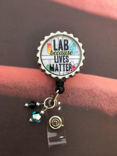 Laboratory Professionals Week is April 24-30!  Here's a badge reel for those who make a difference behind the scenes.  Belt clip back and matching glass beads.   Great gift for coworkers or as a treat-yourself gift! Mobile Phlebotomy, Professional Gift Ideas, Lab Humor, Tech Outfit, Med Lab, Lab Science, Lab Week, Microscopic Photography, Gift For Coworkers