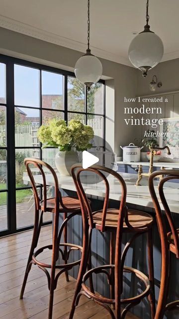 Elle Hervin on Instagram: "How I created a modern vintage kitchen that blends old and new decor to make it feel unique and characterful ✨️. . 1. Second-hand or antique kitchen furniture - my vintage bistro bar stools were a lucky find on eBay and for me, they add so much personality to this space! . 2. Crittall-style kitchen doors and windows - a modern take on heritage doors 🖤 (these are a big expense which we saved for over several years but you can achieve a really effective look on existing doors by painting and then creating the grids with a decent black tape.) . 3. Pendant lights and wall sconces - I went for Art Deco style globe pendants over my kitchen island as they remind me of those you get in a French bistro ✨️. Traditional lighting in a kitchen adds an instant modern vintage Bistro Style Kitchen Ideas, Bistro Bar Stools, 3 Pendant Lights, French Bistro Kitchen, Antique Kitchen Furniture, Modern Vintage Kitchen, Bistro Kitchen, Black Tape, Antique Kitchen