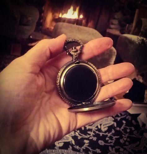 2 inch diameter, pocket size black scrying mirror. Etched, brass finished metal case, working, spring loaded hinge and slightly convex, black scrying mirror inside. So, I'm walking through town recently,and I see a guy take a pocket watch out of his jacket. He just stood there staring at it for a good 2 minutes. I thought, why's he just staring at his watch for so long? What's he seeing in there? When I got home I thought, Ohhh! I could make a pocket black scrying mirrors! I mean, how cool is Black Mirror Witchcraft, Black Mirror Scrying, Wicca Rituals, Seer Aesthetic, Black Scrying Mirror, Scrying Bowl, Ocean Spirit, Scrying Mirror, Types Of Magic