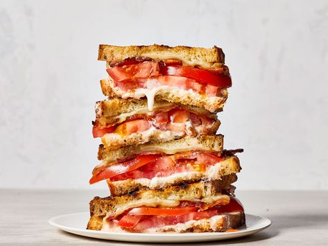 Ultimate Grilled Tomato Sandwiches | Toasty bread, juicy tomatoes, melty cheese, and smoky bacon—what’s not to love? These decadent grilled sandwiches are the perfect place to put your ripe summer tomatoes, and pair beautifully with a light, refreshing summer soup. While you could certainly prepare them in a skillet on the stove, going to the grill takes these superb summer sandwiches to the next level. Tomato Sandwich Recipes, Heirloom Tomato Recipes, Tomato Sandwiches, Grilled Sandwiches, Grill Sandwich, Summer Sandwiches, Cheese And Tomato, Summer Soup, Grilled Tomatoes